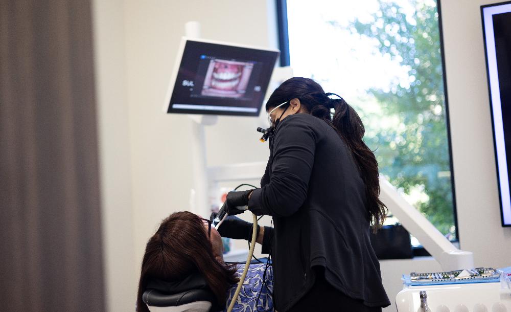 Woman pointing at her mouth, brentwood tn